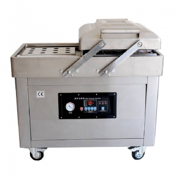 Double chamber vacuum packing machine